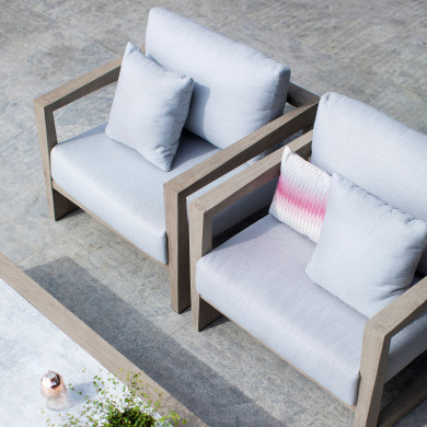 SKAAL club armchair with light grey Sunbrella cushions Les Jardins